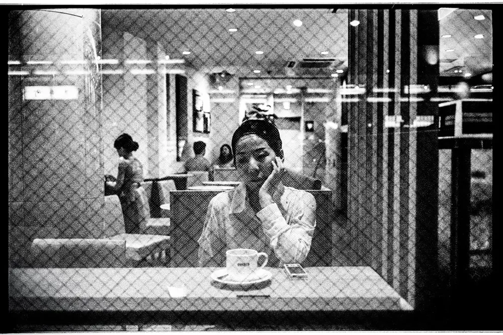A woman deep in her thoughts in a cafe’ in Kyoto.
