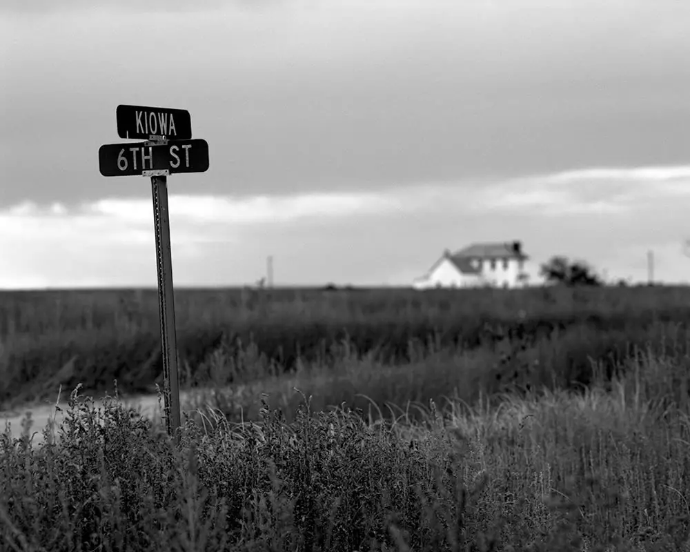 Signs still mark abandoned streets - Arlington, Colorado. Pentax 6x7, 45mm f/4, Ilford Pan F Plus
