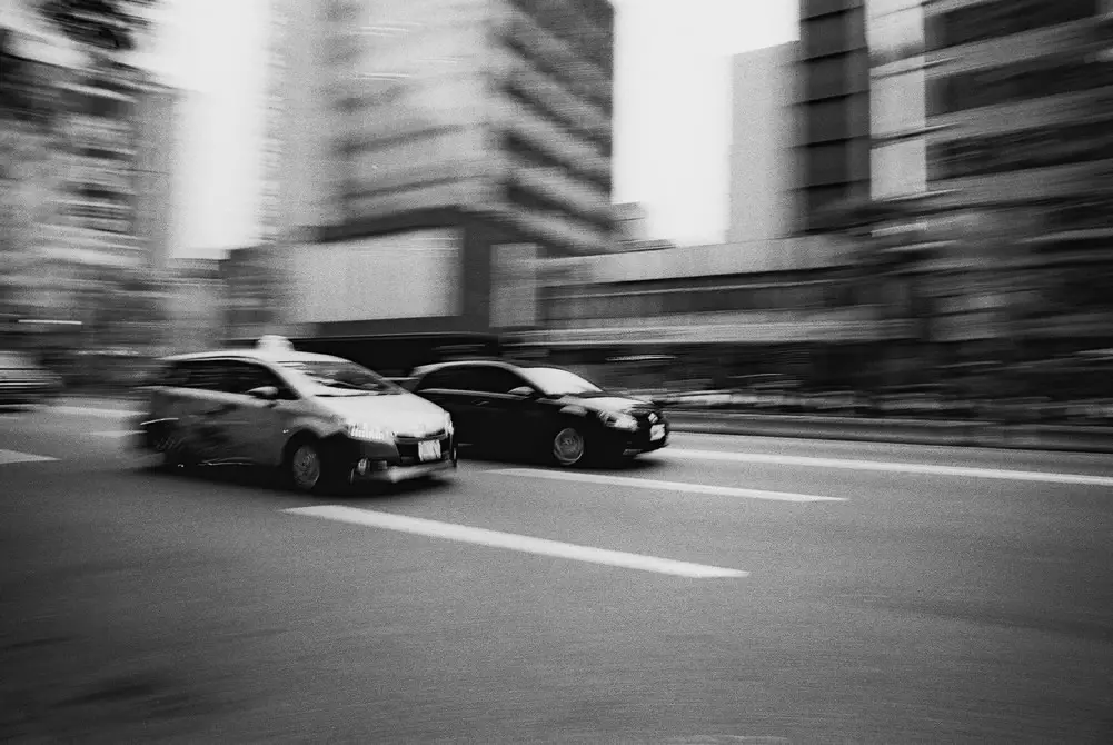 Street racers - Ilford FP4+ shot at EI 800. Black and white negative film in 35mm format. Push processed 2+2/3 stops.