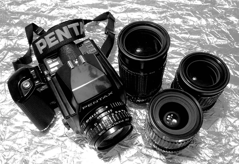 My current Pentax 645 system – Camera with 75mm, 200mm, 45mm, and 150mm (left to right)