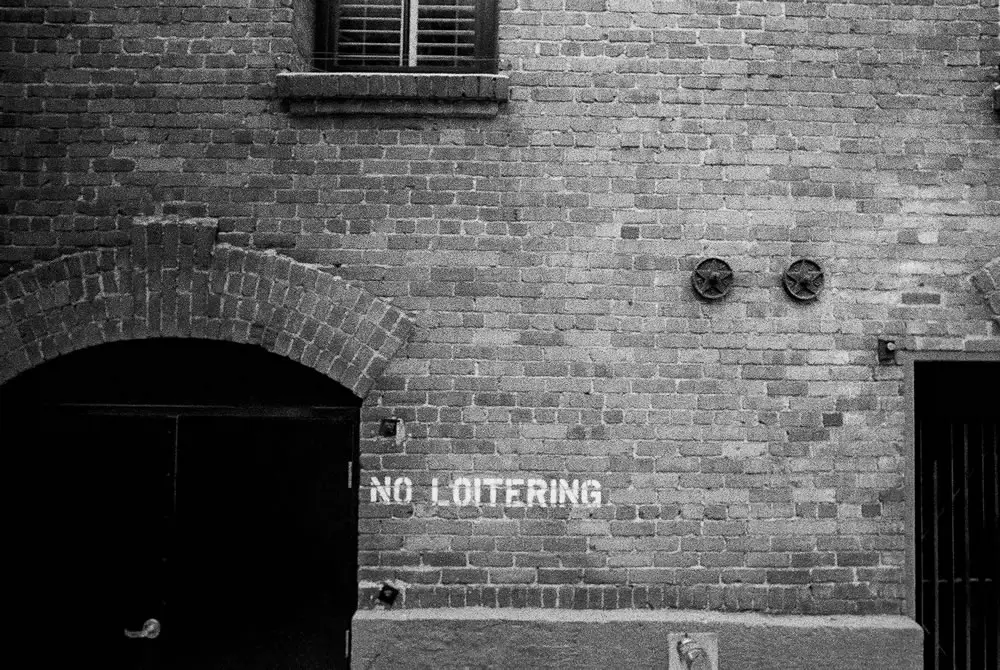 No loitering - Shot on Fuji Neopan 400 at EI 400. Black and white negative film in 35mm format.