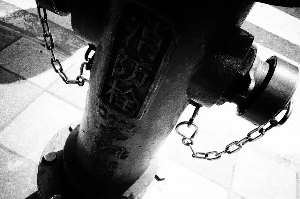 Chained - Shot on Fuji Neopan SS at EI 100. Black and white negative film in 35mm format.