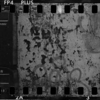 Postie - Shot on ILFORD FP4 PLUS at EI 100. Black and white negative film in 35mm format. Holga 120 PAN + Schneider Angulon 90mm f/6.8