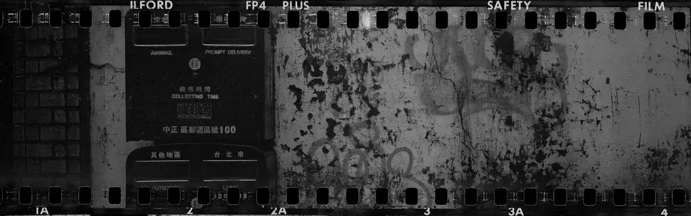 Postie - Shot on ILFORD FP4 PLUS at EI 100. Black and white negative film in 35mm format. Holga 120 PAN + Schneider Angulon 90mm f/6.8