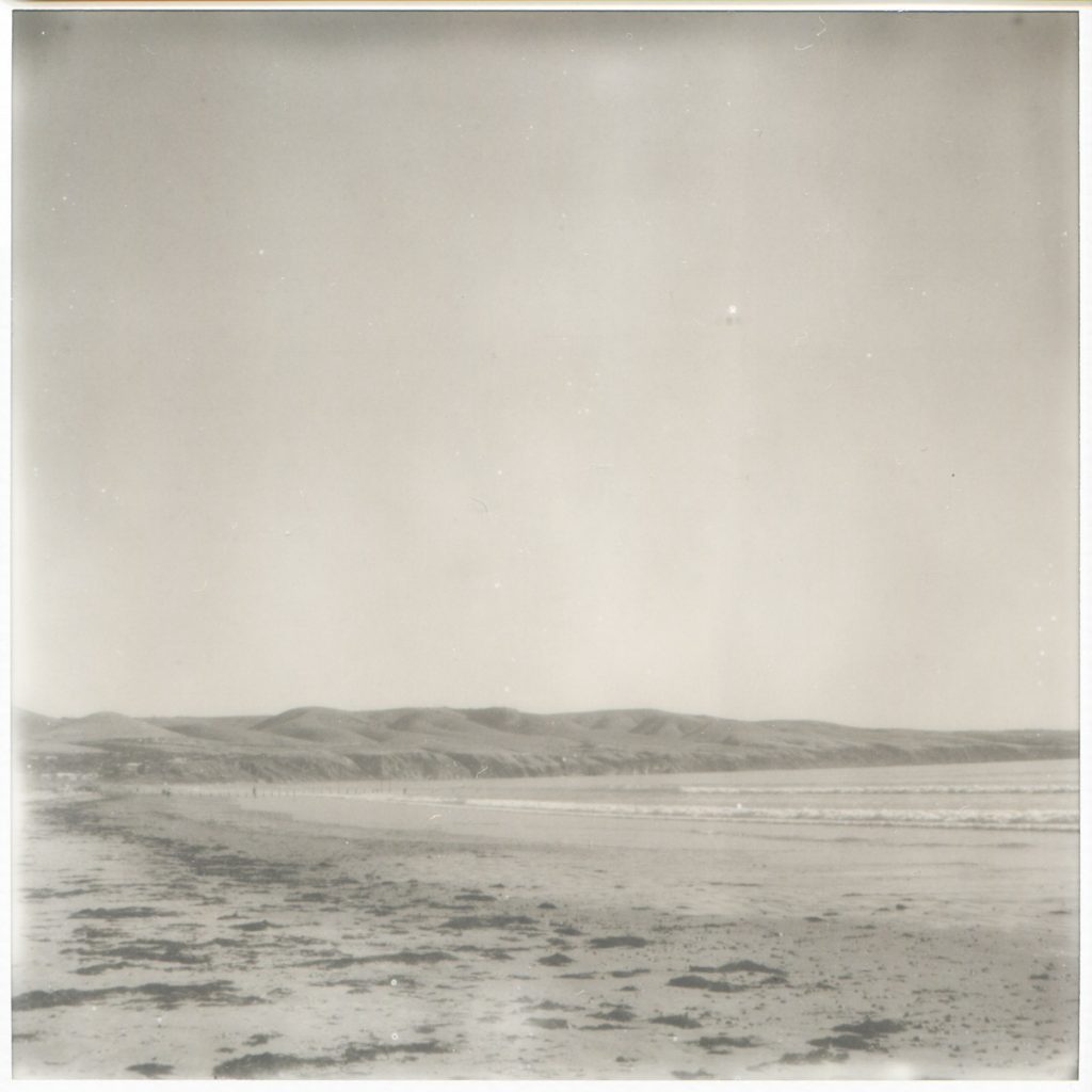 “On the beach” 2018. Untouched scan of Impossible SX70 B+W