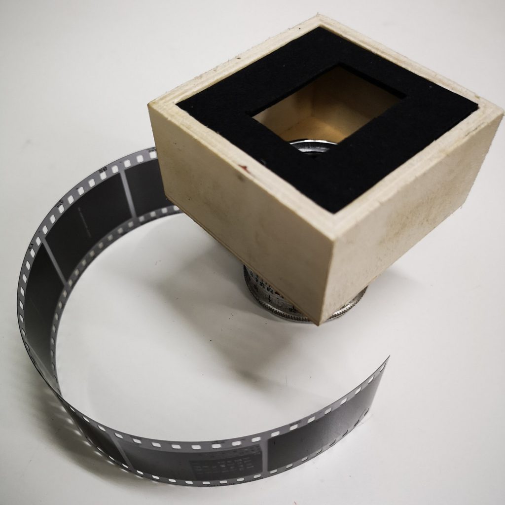 Focusing unit, bottom half (lens and film mask in place)