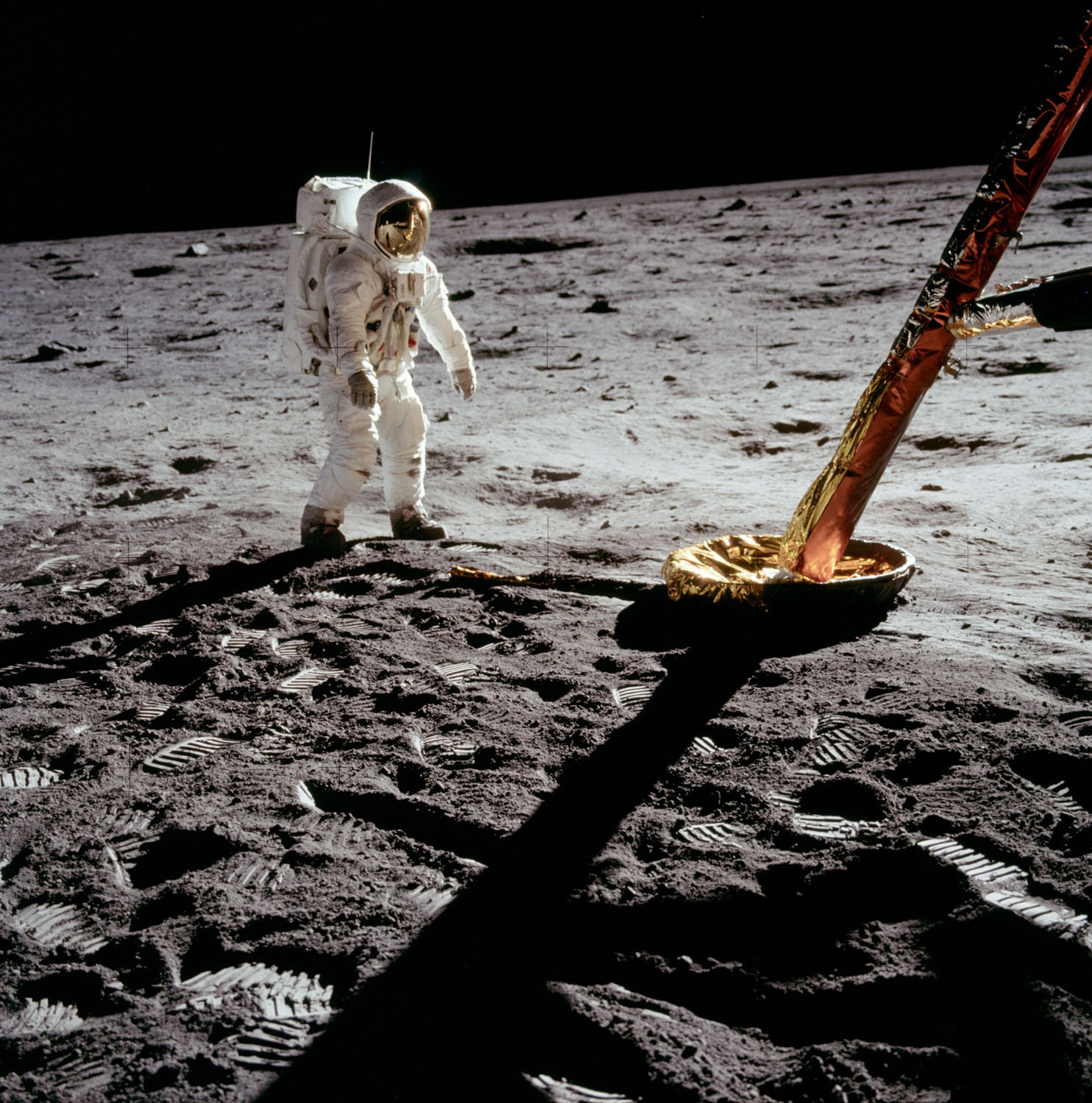Lunar Excursion Module north-facing strut and footpad (bottom right), with Buzz Aldrin beside. Credit: Neil Armstrong, NASA ID: AS11-40-5902