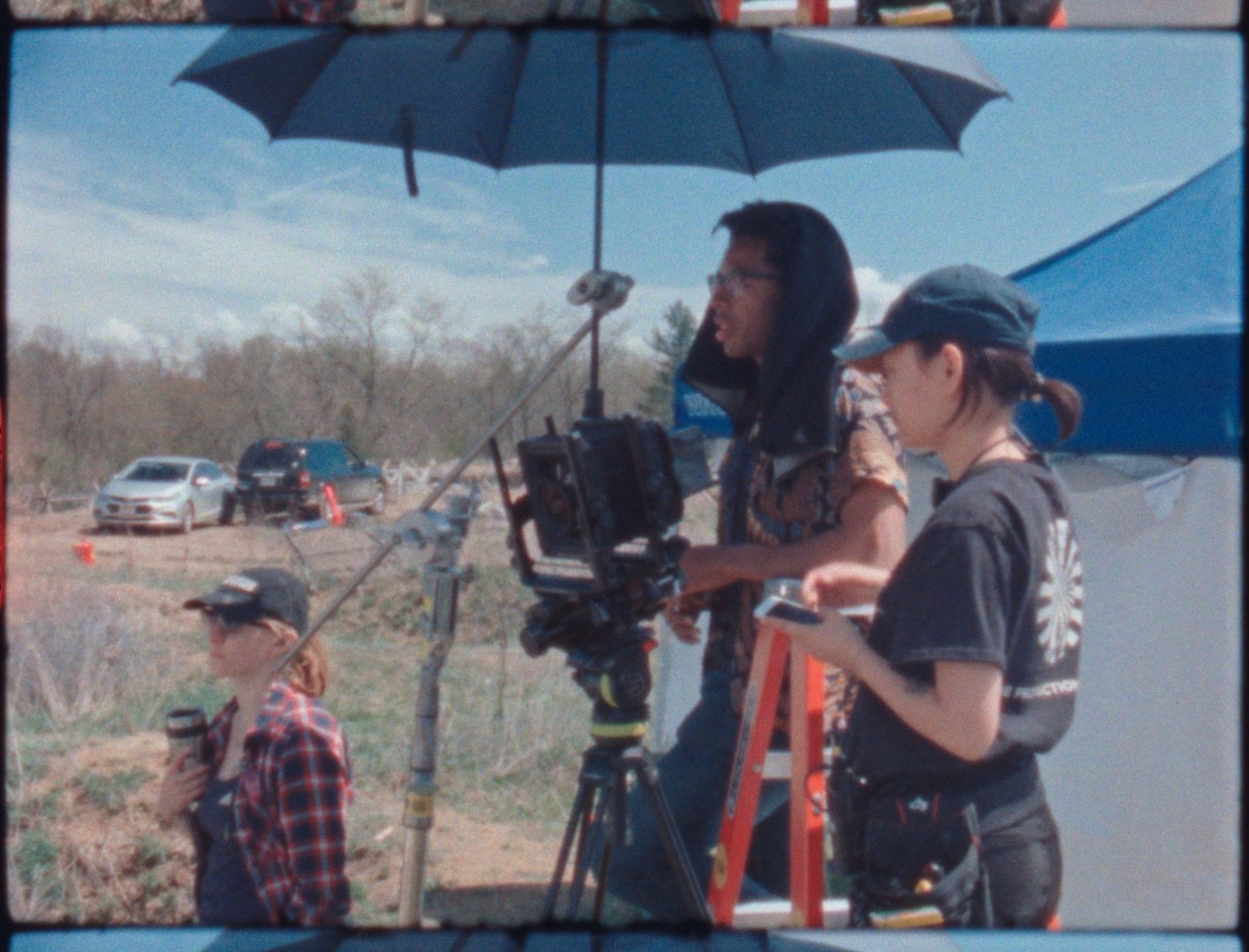Super 8 BTS footage. That’s me behind the camera, wearing the dark cloth on set of one of my shoots along with Kat Cameron, 1st AD, on the left and Sunnie Kim, 1st AC, on the right.