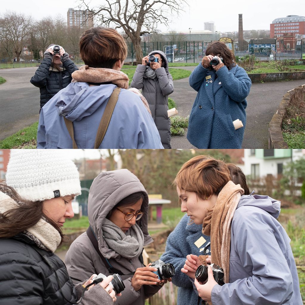 Marina Llopis teaching several photography students outside