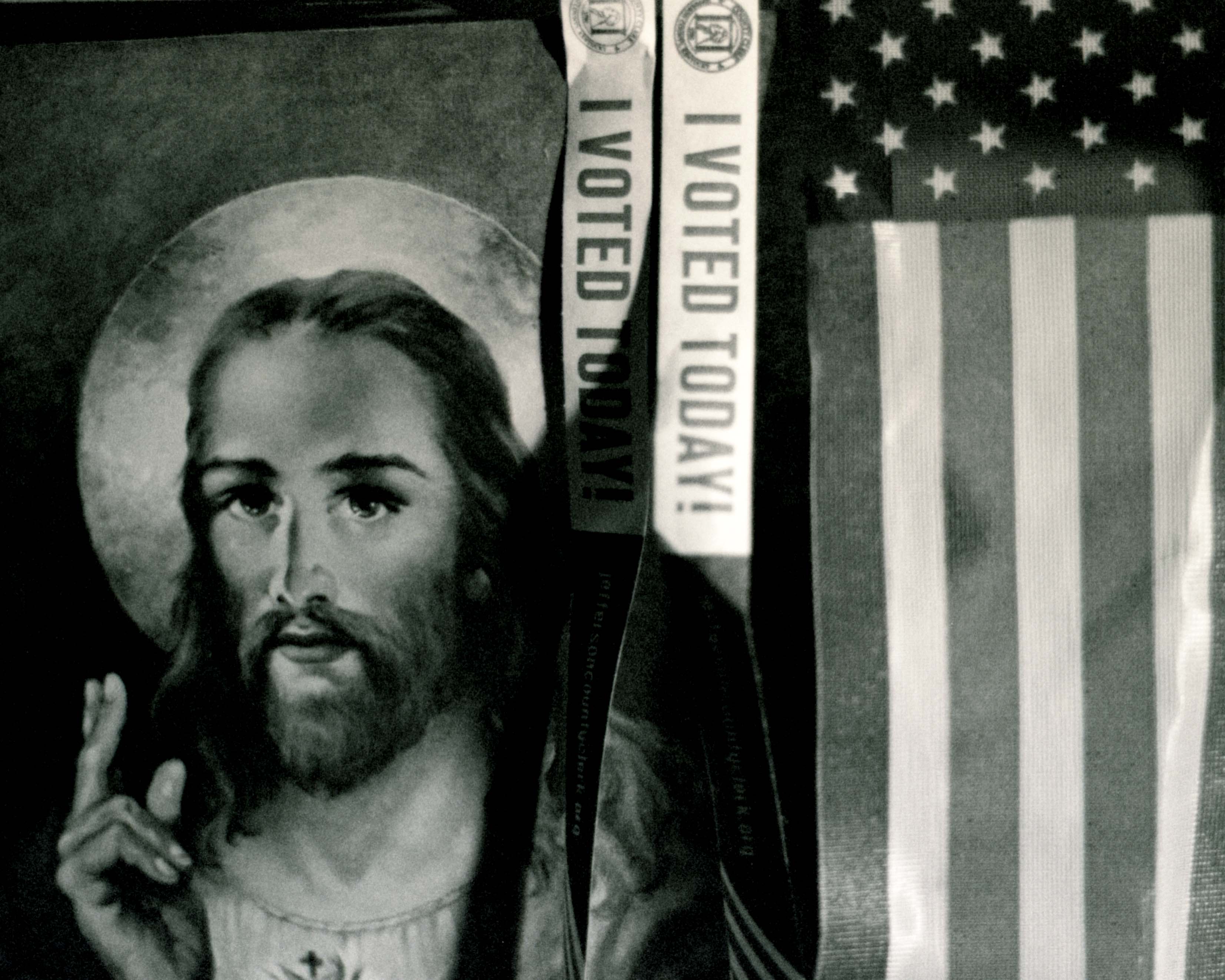 a picture of jesus next to a USA flag with i voted today strips hanging down