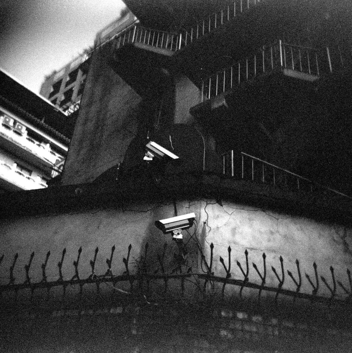 You've got you covered - shot at EI 800 (120 format) on a Kodak Tri-X 400.  Black and white negative film shot as 6x6 in 120 format.  Holga 120GN + 60mm f/8 Lens