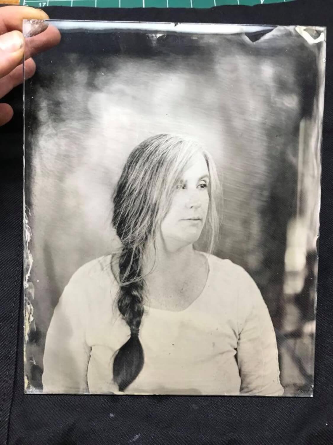 An ambrotype (glass negative) of my partner. Plates are typically made either from glass or black aluminium. They used to be made from tin, hence the term “tintype.”