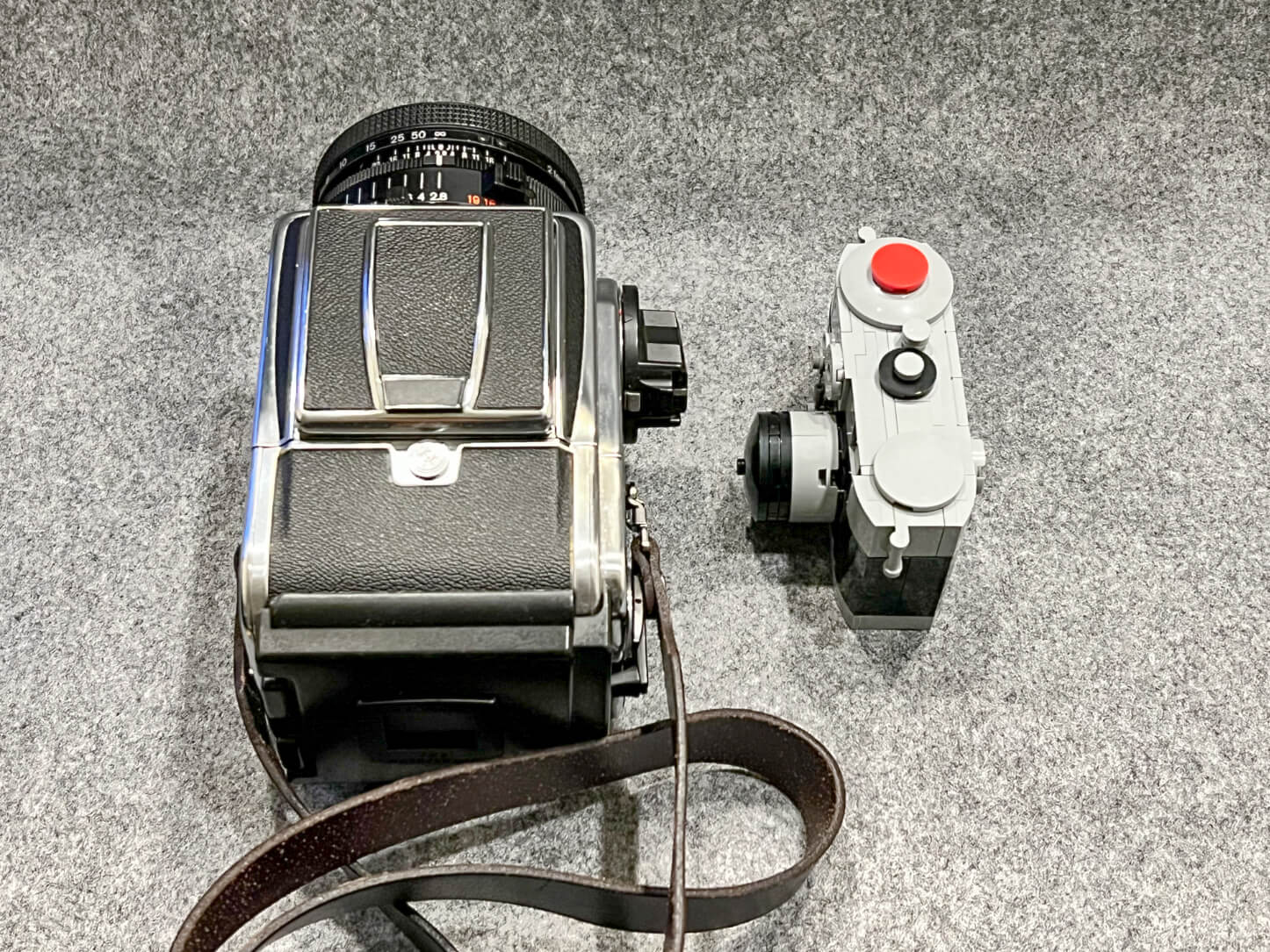 Hasselblad 2000FCW and Planar F 80mm f:2.8 against Lego VIP rangefinder camera 6392344