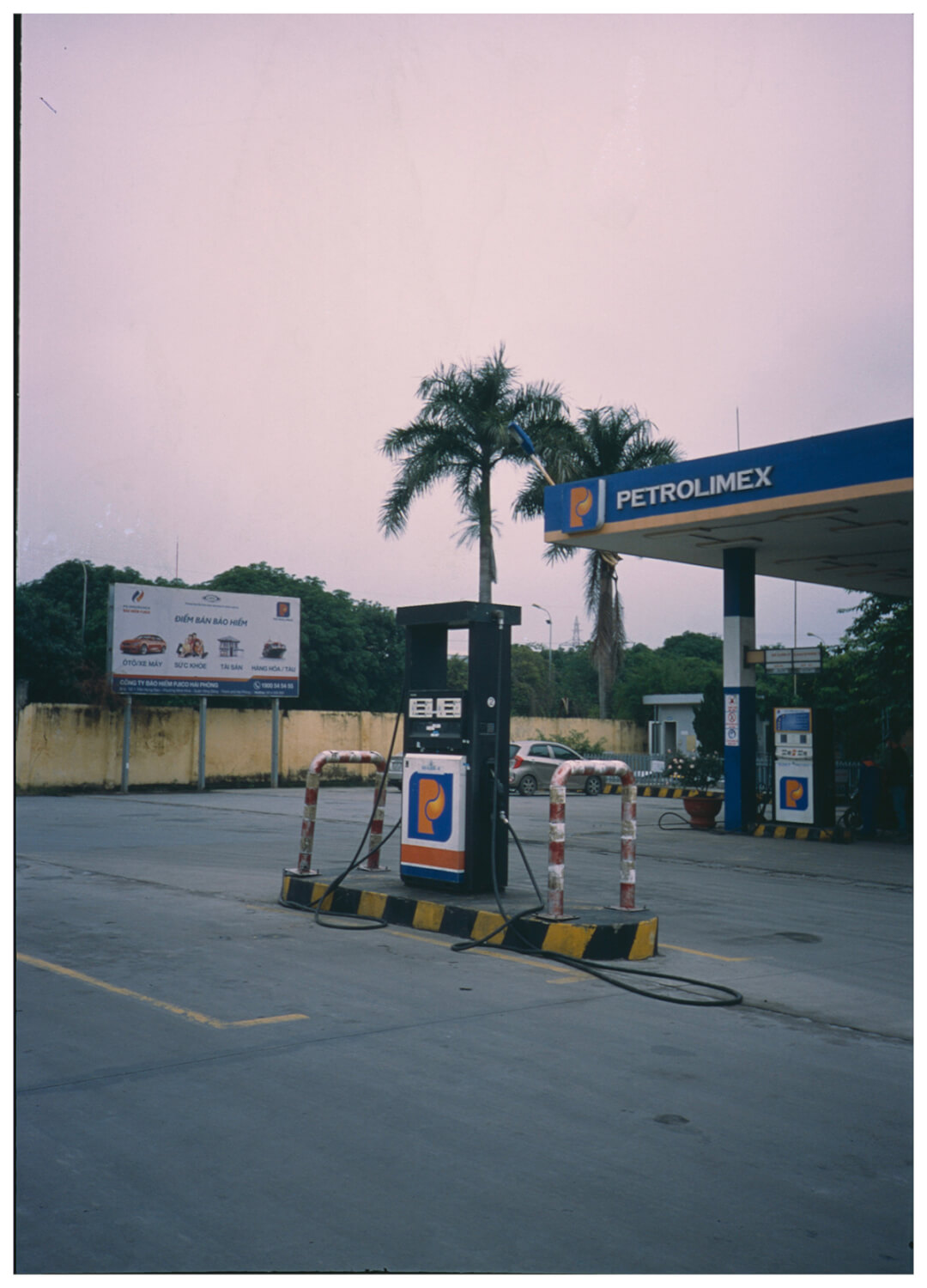 Photo of the gas station on Expired Fuji Provia 100F @200 using Olympus XA2 35mm film camera.