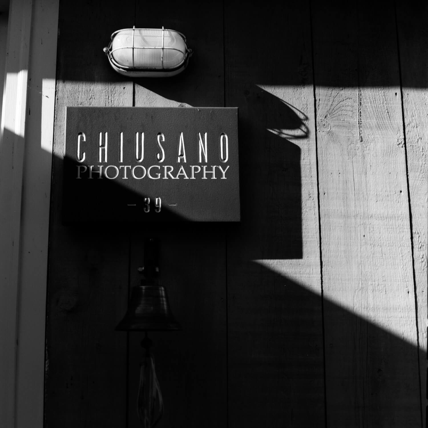 Chiusano Photography sign Strong diagonals - can often be handled best in a square frame. Shot on a Rollei 3.5F with Kodak T-MAX 400 film