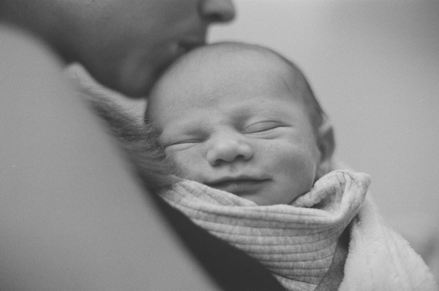 8 Frames... Of my newborn son on ILFORD HP5 PLUS (35mm Format / Nikon Nikkormat / Nikkor 50mm f/1.4 AI-S) - by Spencer Cameron 