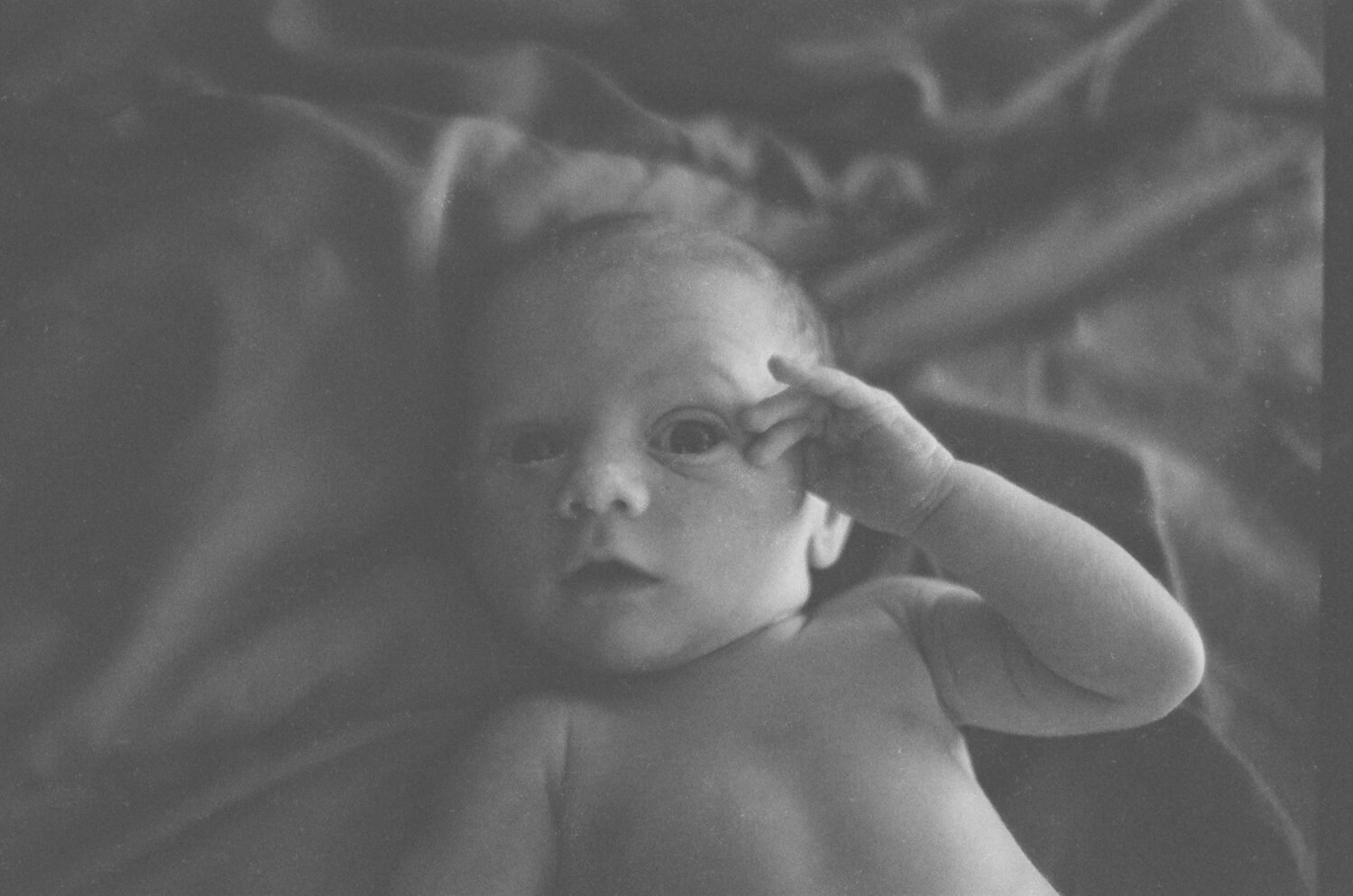 8 Frames... Of my newborn son on ILFORD HP5 PLUS (35mm Format / Nikon Nikkormat / Nikkor 50mm f/1.4 AI-S) - by Spencer Cameron 