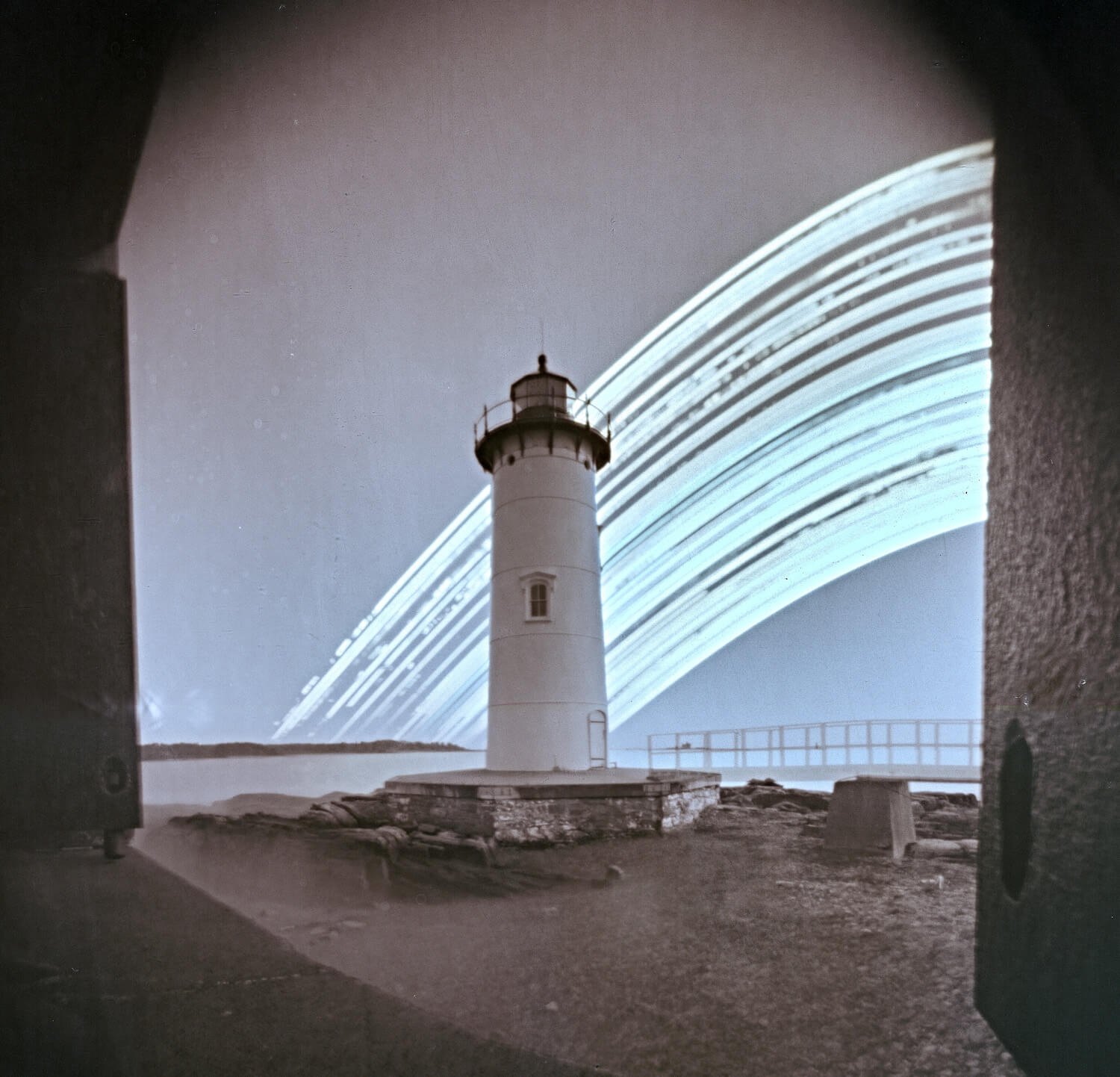 Portsmouth Harbor Light, Portsmouth, NH. The destruction of the footbridge to the light in December 2022 lends a ghostly element to this image, and tells the story of crashing waves, freezing winds, and a destructive sea.